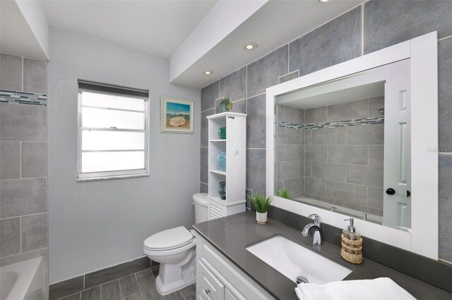 12913 126th Ter, Largo, FL 33774 - bathroom with vanity, toilet, shower / bath combination, and recessed lighting