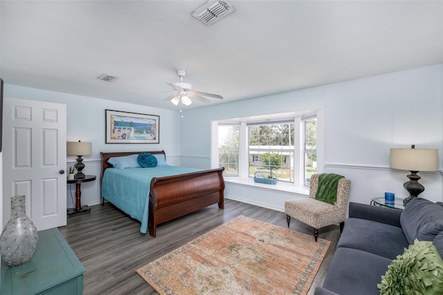 12913 126th Ter, Largo, FL 33774 - bedroom with wood finished floors, ceiling fan, and baseboards