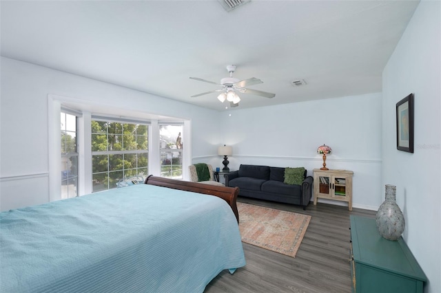 12913 126th Ter, Largo, FL 33774 - bedroom with wood finished floors, a ceiling fan, and baseboards
