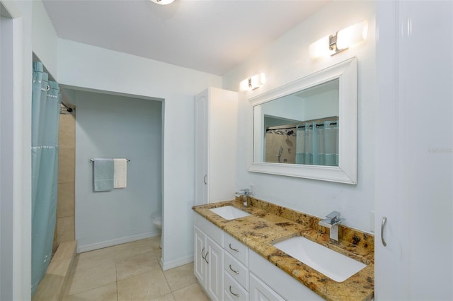 12913 126th Ter, Largo, FL 33774 - bathroom featuring double vanity, toilet, a shower with shower curtain, and tile patterned floors