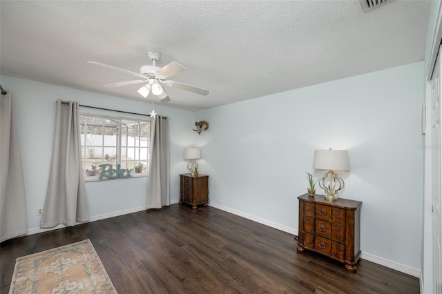 12913 126th Ter, Largo, FL 33774 - unfurnished room featuring wood finished floors, ceiling fan, baseboards, and a textured ceiling
