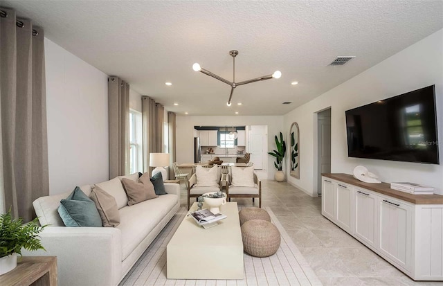 8303 SW 54th Loop, Ocala, FL 34481 - living area featuring recessed lighting, a textured ceiling, and light tile patterned floors