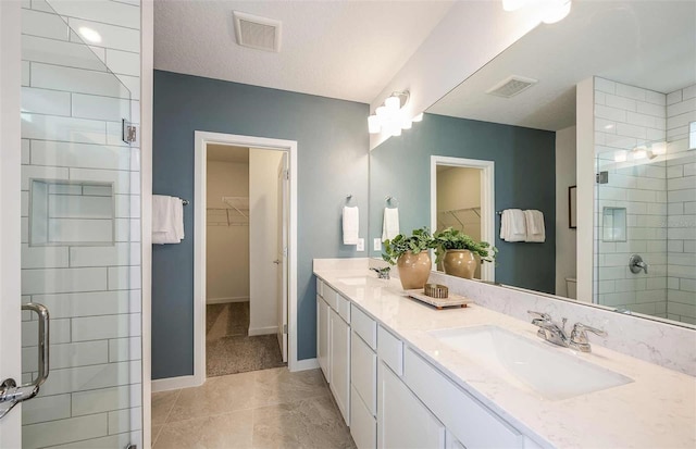 8303 SW 54th Loop, Ocala, FL 34481 - bathroom featuring a stall shower, baseboards, and double vanity