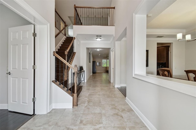 11624 Calf Path Dr, Tampa, FL 33626 - entrance foyer with stairs, crown molding, and baseboards