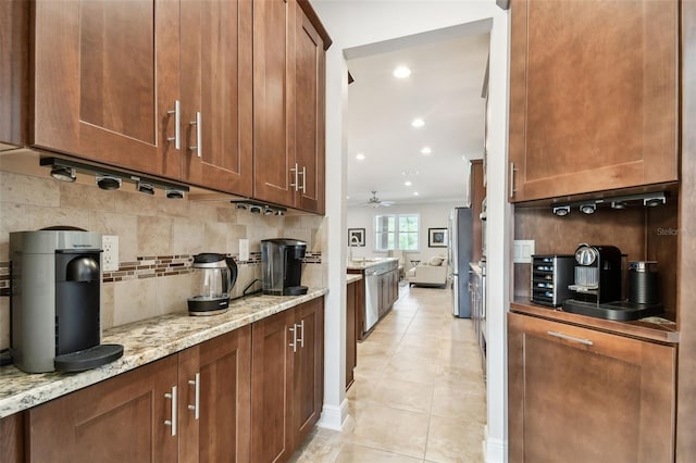 11624 Calf Path Dr, Tampa, FL 33626 - bar featuring backsplash, ceiling fan, light tile patterned floors, recessed lighting, and appliances with stainless steel finishes