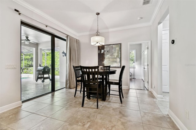 11624 Calf Path Dr, Tampa, FL 33626 - dining room featuring baseboards, light tile patterned flooring, crown molding, and ceiling fan