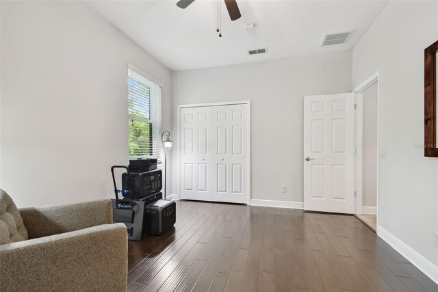 11624 Calf Path Dr, Tampa, FL 33626 - living area with a ceiling fan, dark wood-style flooring, and baseboards