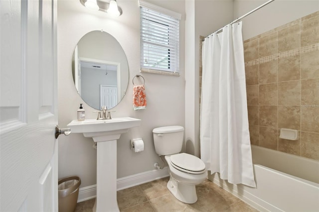 11624 Calf Path Dr, Tampa, FL 33626 - full bathroom with toilet, tile patterned floors, shower / bath combination with curtain, and baseboards