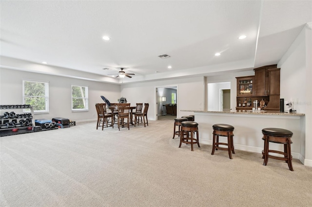 11624 Calf Path Dr, Tampa, FL 33626 - dining space featuring light colored carpet, a tray ceiling, recessed lighting, and a ceiling fan