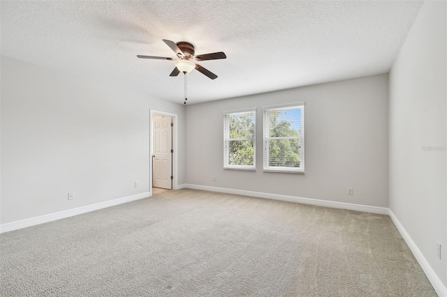 11624 Calf Path Dr, Tampa, FL 33626 - unfurnished room featuring a ceiling fan, a textured ceiling, baseboards, and light carpet