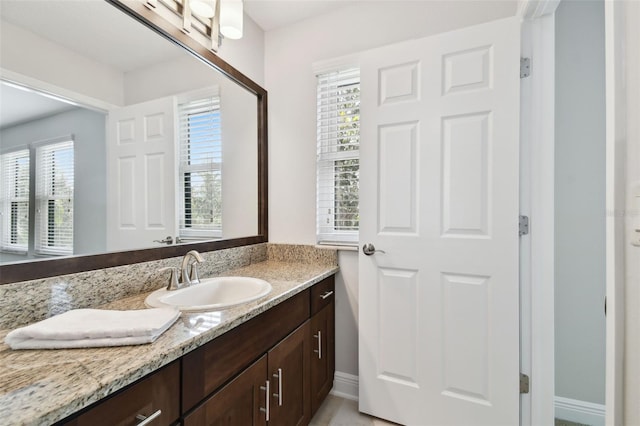 11624 Calf Path Dr, Tampa, FL 33626 - bathroom featuring vanity and baseboards