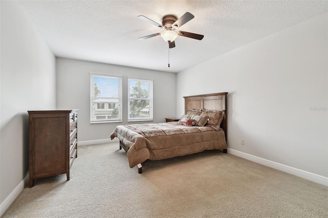 11624 Calf Path Dr, Tampa, FL 33626 - bedroom with light colored carpet, baseboards, a ceiling fan, and a textured ceiling