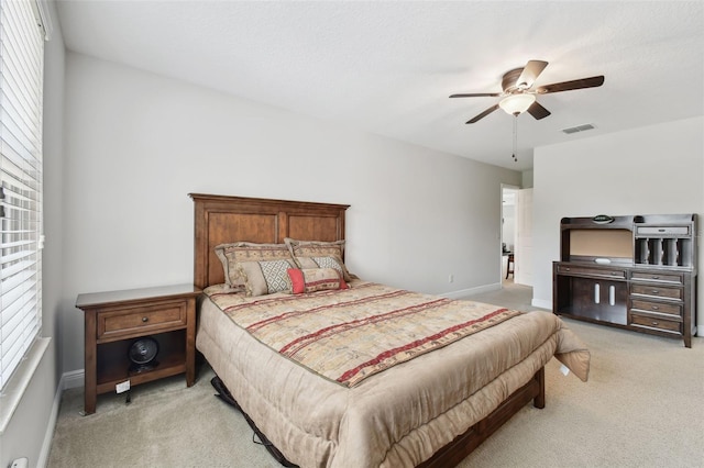 11624 Calf Path Dr, Tampa, FL 33626 - bedroom featuring light colored carpet, a ceiling fan, and baseboards