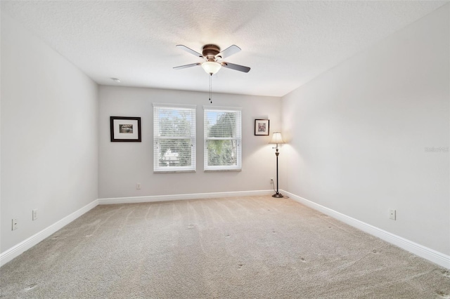 11624 Calf Path Dr, Tampa, FL 33626 - unfurnished room with ceiling fan, light colored carpet, baseboards, and a textured ceiling