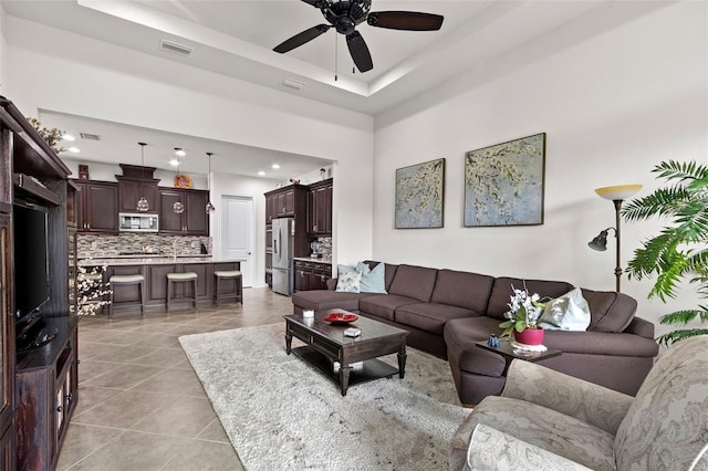 4195 Barletta Ct, Wesley Chapel, FL 33543 - living area featuring ceiling fan, light tile patterned floors, recessed lighting, and a raised ceiling