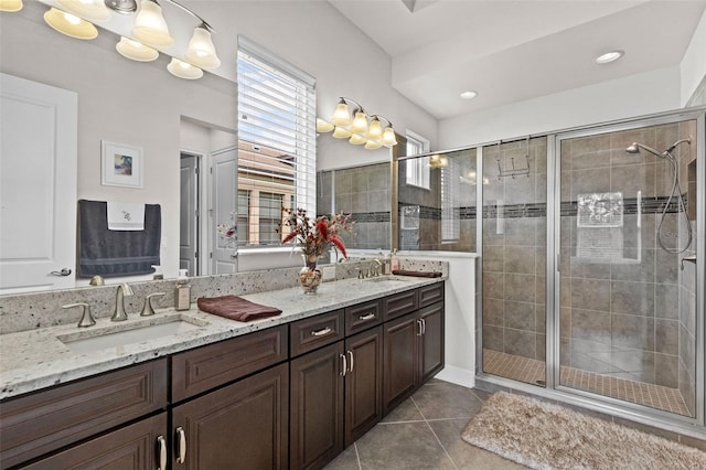 4195 Barletta Ct, Wesley Chapel, FL 33543 - full bathroom featuring double vanity, tile patterned flooring, a stall shower, and recessed lighting