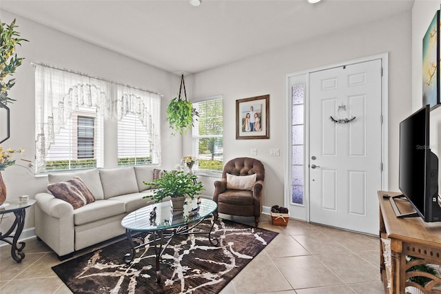 4195 Barletta Ct, Wesley Chapel, FL 33543 - living room featuring light tile patterned flooring and baseboards