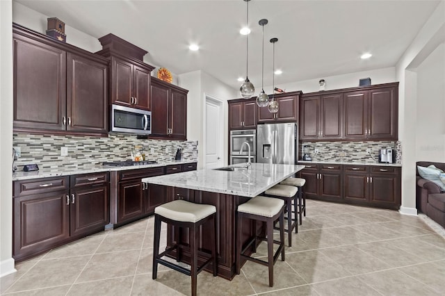 4195 Barletta Ct, Wesley Chapel, FL 33543 - kitchen with appliances with stainless steel finishes, decorative backsplash, a kitchen breakfast bar, light tile patterned floors, and recessed lighting