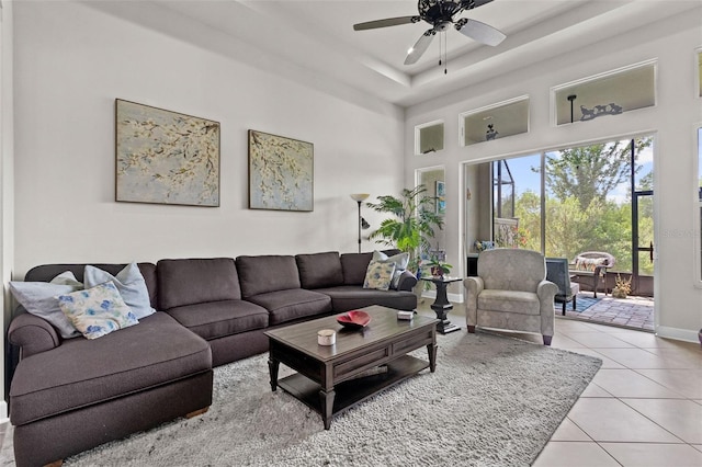 4195 Barletta Ct, Wesley Chapel, FL 33543 - living room featuring tile patterned floors, ceiling fan, and a towering ceiling