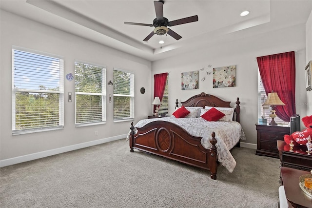 4195 Barletta Ct, Wesley Chapel, FL 33543 - carpeted bedroom with a tray ceiling, ceiling fan, and recessed lighting