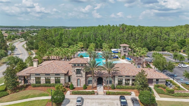 4195 Barletta Ct, Wesley Chapel, FL 33543 - view of front of home with stone siding, a tiled roof, and stucco siding