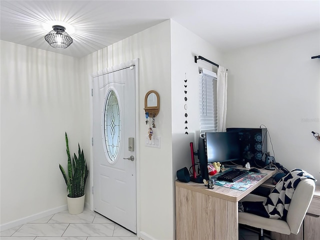 foyer featuring baseboards and light marble finish flooring
