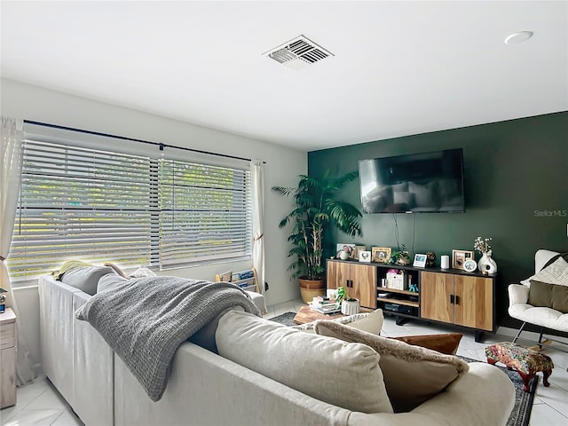 living area featuring light tile patterned flooring