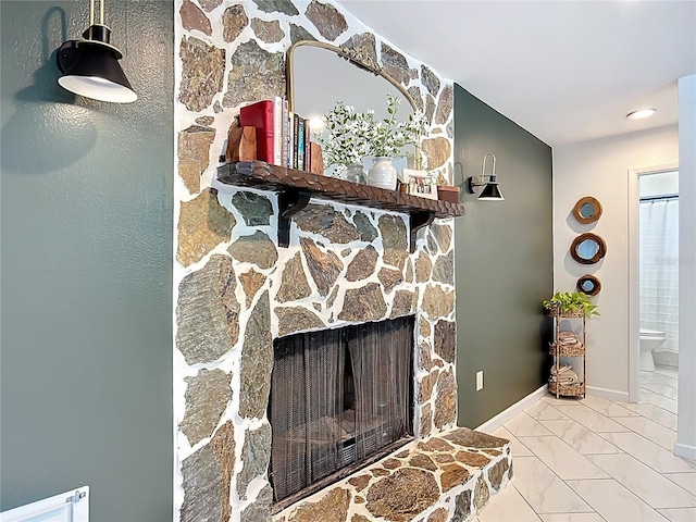 detailed view of a fireplace and baseboards
