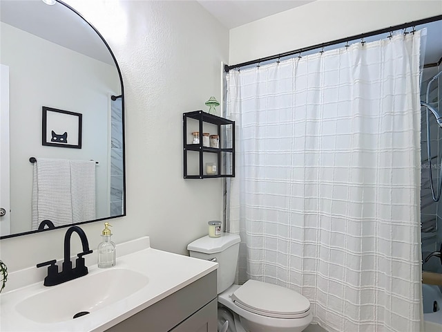 bathroom featuring toilet, vanity, and shower / tub combo