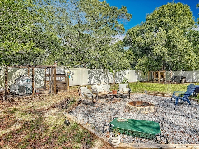 fenced backyard featuring a fire pit and a patio