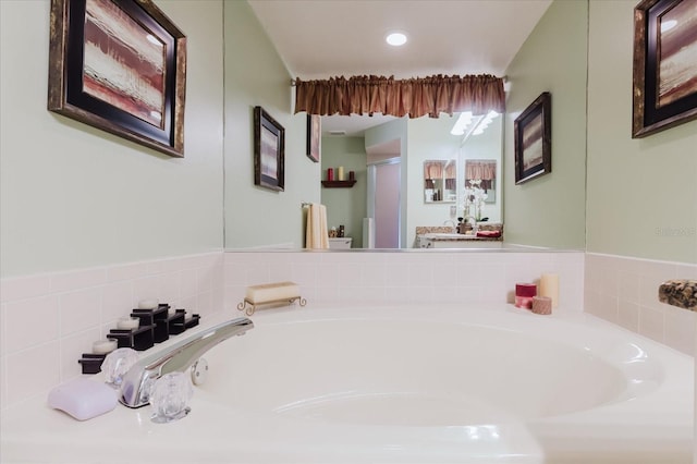 bathroom featuring a garden tub, a stall shower, and recessed lighting