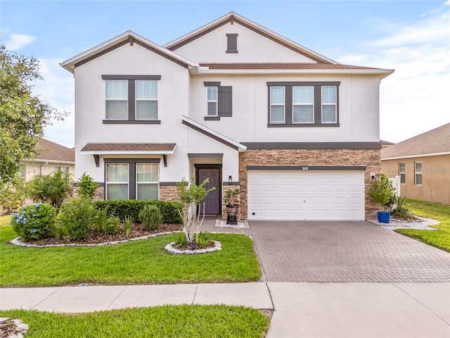 3212 Calvano Dr, Land O Lakes, FL 34639 - view of front of house with stone siding, stucco siding, and decorative driveway