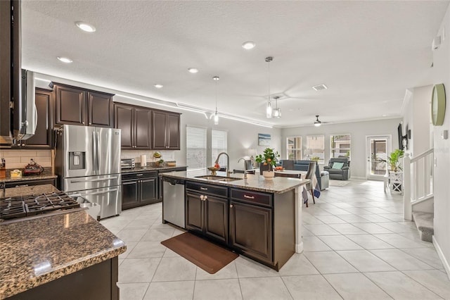 3212 Calvano Dr, Land O Lakes, FL 34639 - kitchen featuring a sink, stainless steel appliances, healthy amount of natural light, backsplash, and recessed lighting