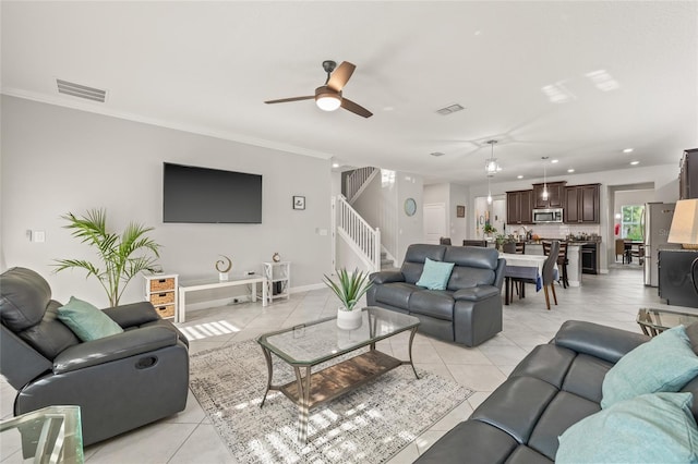 3212 Calvano Dr, Land O Lakes, FL 34639 - living area featuring stairs, a ceiling fan, light tile patterned floors, ornamental molding, and recessed lighting