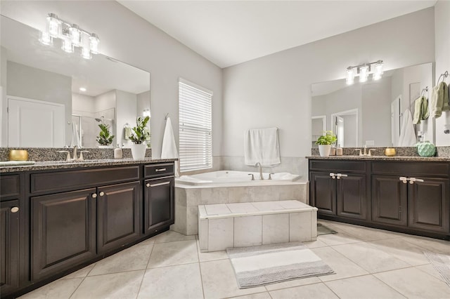 3212 Calvano Dr, Land O Lakes, FL 34639 - full bathroom with a garden tub, a stall shower, tile patterned floors, and two vanities