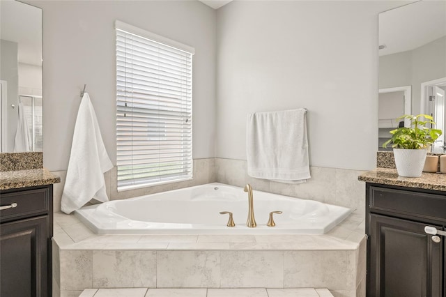 3212 Calvano Dr, Land O Lakes, FL 34639 - full bath with vanity, a garden tub, and a shower stall