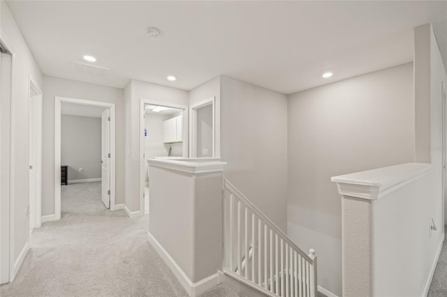 3212 Calvano Dr, Land O Lakes, FL 34639 - corridor featuring an upstairs landing, light carpet, recessed lighting, and baseboards