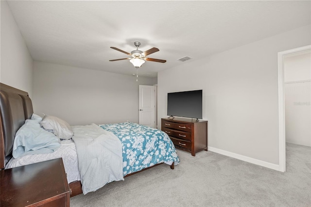 3212 Calvano Dr, Land O Lakes, FL 34639 - bedroom with light colored carpet, a ceiling fan, and baseboards
