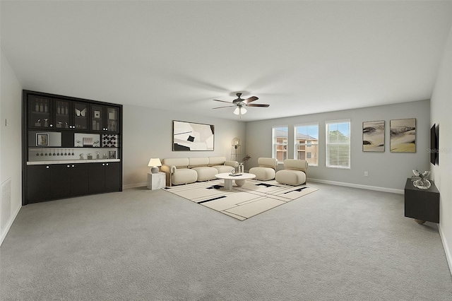 3212 Calvano Dr, Land O Lakes, FL 34639 - carpeted living area featuring baseboards and a ceiling fan