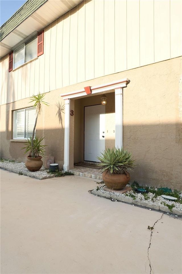 300 6th St N Unit E3, Safety Harbor, FL 34695 - property entrance featuring stucco siding