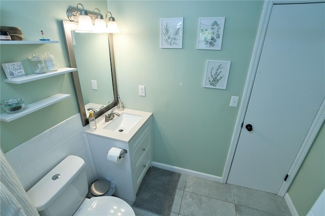300 6th St N Unit E3, Safety Harbor, FL 34695 - bathroom featuring tile patterned flooring, toilet, and vanity