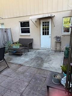 300 6th St N Unit E3, Safety Harbor, FL 34695 - view of patio featuring fence