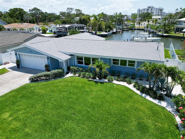 1769 Brookside Blvd, Largo, FL 33770 - ranch-style house featuring a shingled roof, a garage, a water view, concrete driveway, and stucco siding