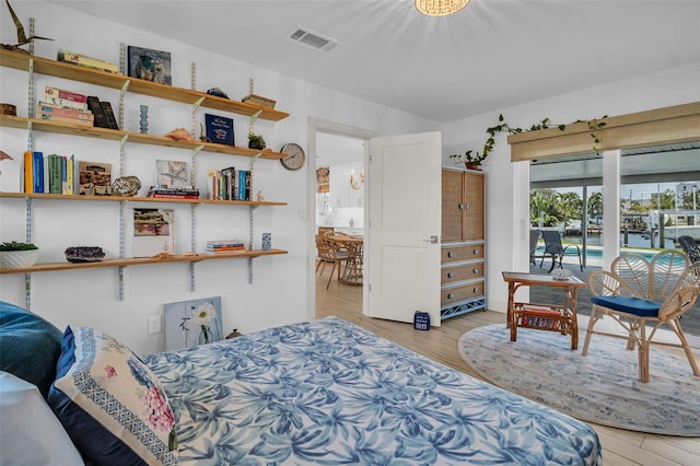 1769 Brookside Blvd, Largo, FL 33770 - bedroom featuring light wood finished floors and access to outside