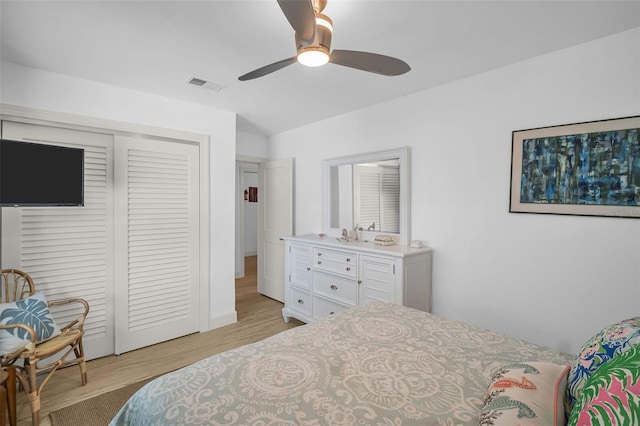 1769 Brookside Blvd, Largo, FL 33770 - bedroom with a closet, light wood finished floors, and a ceiling fan