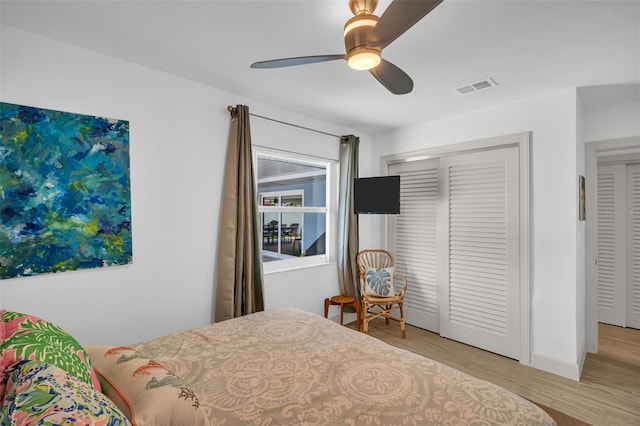 1769 Brookside Blvd, Largo, FL 33770 - bedroom with wood finished floors, ceiling fan, baseboards, and a closet