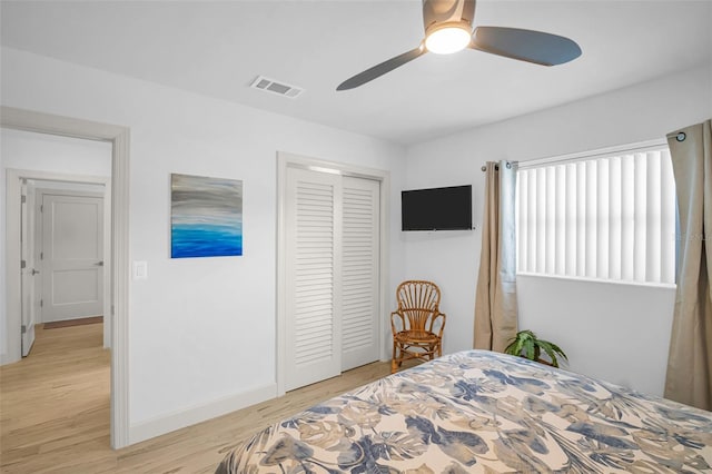 1769 Brookside Blvd, Largo, FL 33770 - bedroom with a closet, light wood-style floors, baseboards, and ceiling fan