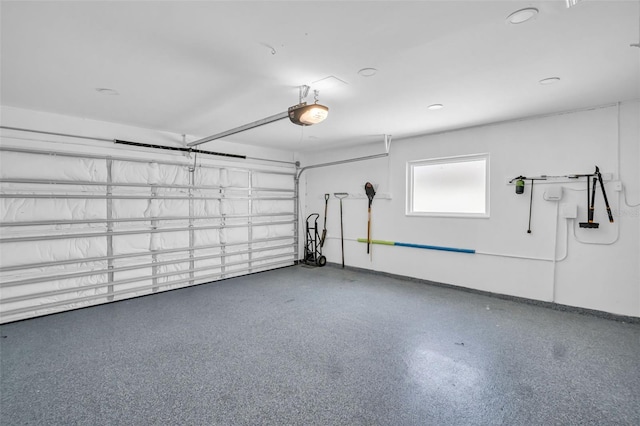 1769 Brookside Blvd, Largo, FL 33770 - garage with a garage door opener and baseboards