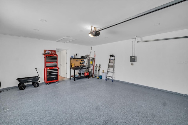 1769 Brookside Blvd, Largo, FL 33770 - garage featuring water heater, a garage door opener, and baseboards
