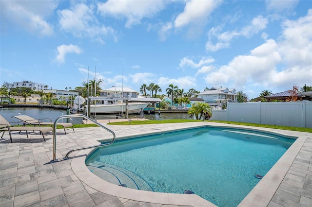 1769 Brookside Blvd, Largo, FL 33770 - swimming pool featuring fence, a patio, a water view, and boat lift